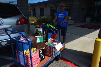 It took three loaded carts to bring in all of the school supplies.